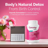 Conceive Plus birth control detox supplement bottle on a pink background with flowers and a calendar.