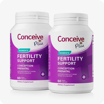 For Conceive Plus Fertility Support Bundle for Him and Her, twin-pack of women’s fertility support bottles with vibrant purple labels, each containing 60 vegan capsules formulated to assist conception through essential multivitamins—ideal for consistent daily use or long-term fertility planning.