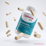 Conceive Plus prenatal supplement bottle with capsules on a light gray background