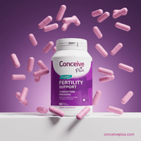 Conceive Plus fertility support supplement bottle with pink capsules on a purple background